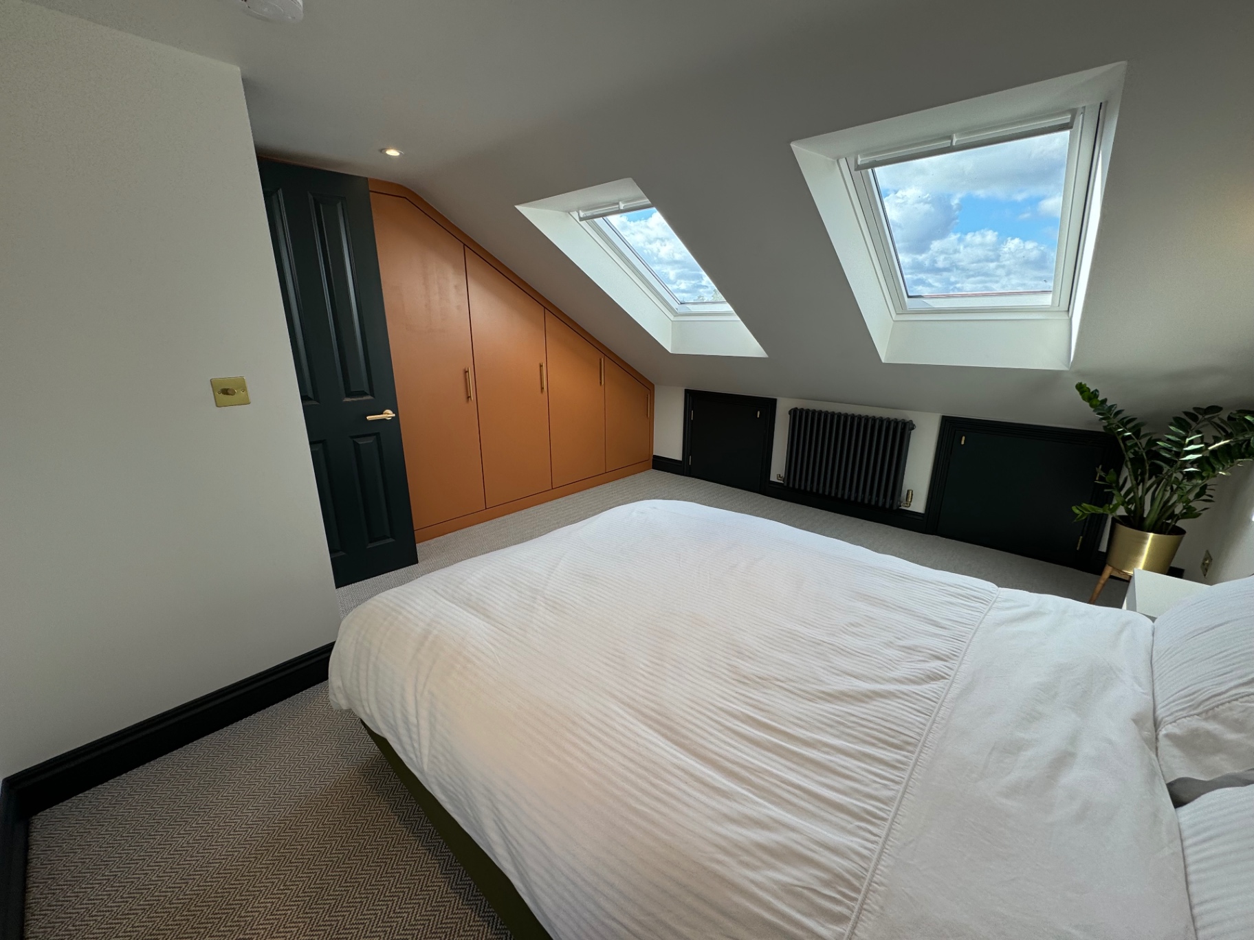 Loft conversion bedroom with bespoke fitted wardrobes